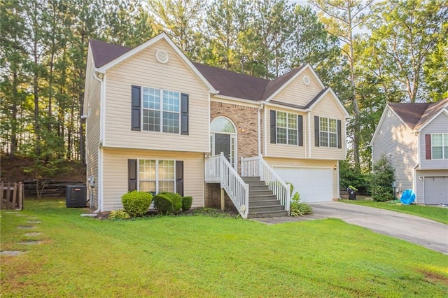 5033 Kens Ct, Stockbridge, GA 30281 - bi-level home featuring an attached garage, concrete driveway, and a front yard