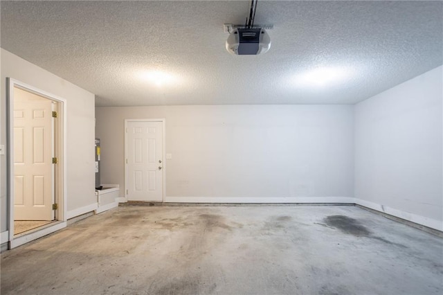 5033 Kens Ct, Stockbridge, GA 30281 - garage with a garage door opener and baseboards