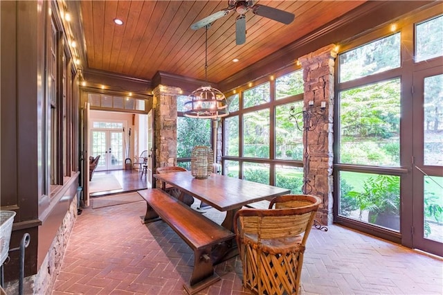 sunroom / solarium featuring ceiling fan, wood ceiling, and french doors