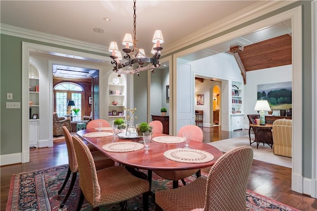 dining space featuring ornamental molding, dark hardwood / wood-style flooring, and built in features