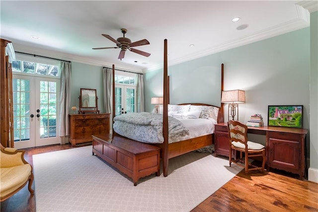 bedroom featuring ornamental molding, ceiling fan, and french doors