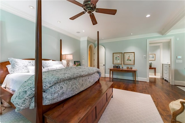 bedroom featuring crown molding, dark hardwood / wood-style floors, and ceiling fan