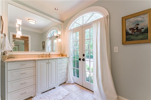 bathroom with ornamental molding, vanity, and french doors