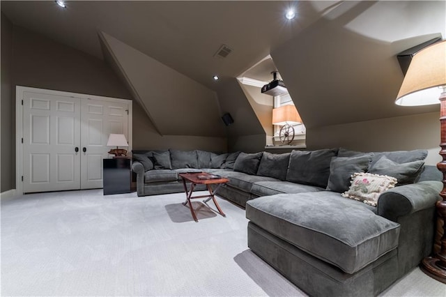 carpeted living room with vaulted ceiling