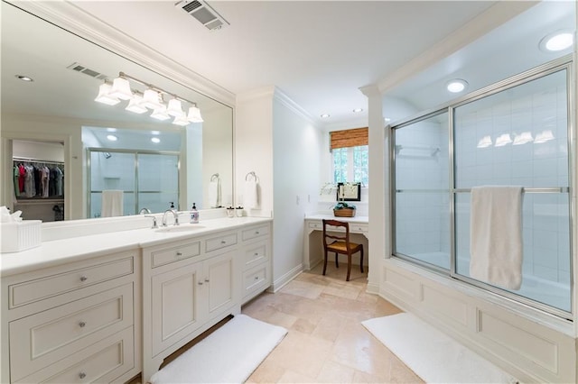 bathroom with ornamental molding, combined bath / shower with glass door, and vanity