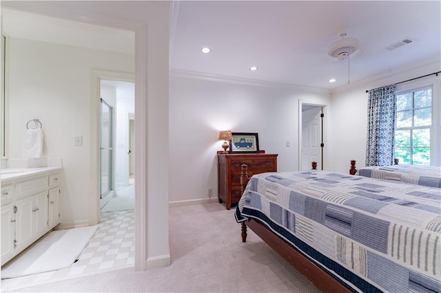 bedroom with ensuite bathroom, ornamental molding, light carpet, and ceiling fan