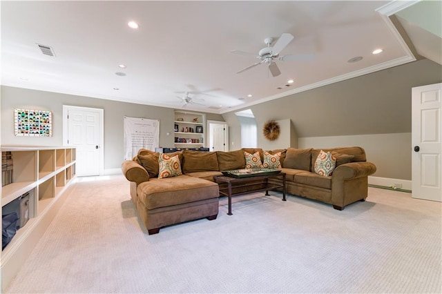 carpeted living room with crown molding, ceiling fan, and built in shelves