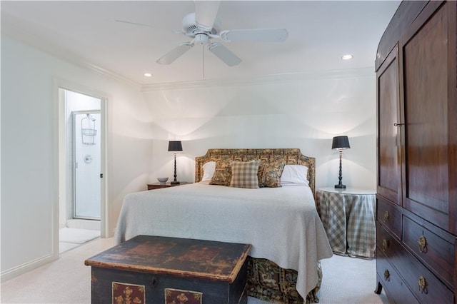 bedroom with ceiling fan, ornamental molding, connected bathroom, and light carpet