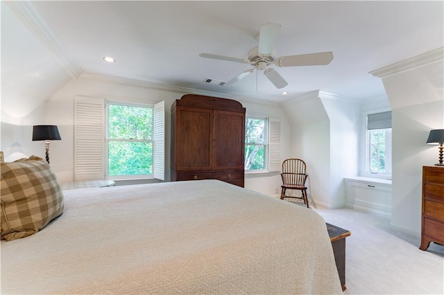 bedroom featuring multiple windows, crown molding, light colored carpet, and ceiling fan