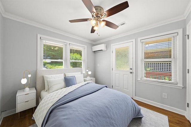 2100 Shady Ln, Tucker, GA 30084 - bedroom featuring an AC wall unit, ornamental molding, baseboards, wood finished floors, and ceiling fan