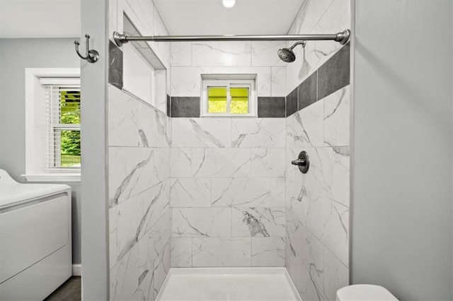 2100 Shady Ln, Tucker, GA 30084 - bathroom with washer / clothes dryer, toilet, and a tile shower