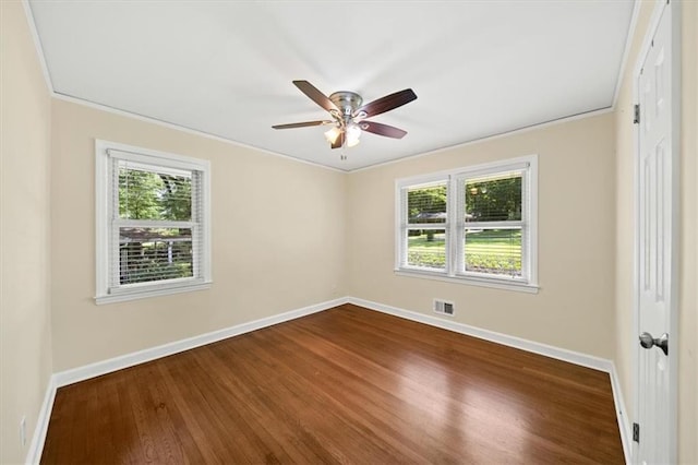 2100 Shady Ln, Tucker, GA 30084 - empty room featuring baseboards, healthy amount of natural light, dark wood-style flooring, and crown molding