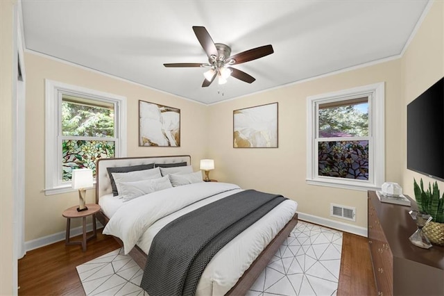 2100 Shady Ln, Tucker, GA 30084 - bedroom with baseboards, light wood-style floors, a ceiling fan, and crown molding