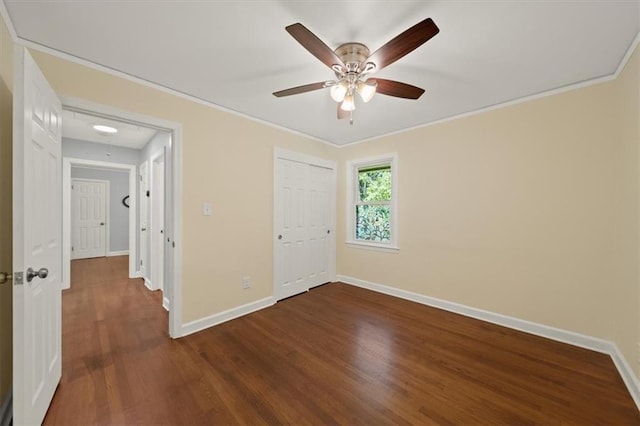 2100 Shady Ln, Tucker, GA 30084 - unfurnished bedroom featuring dark wood-style floors, baseboards, ornamental molding, a closet, and attic access