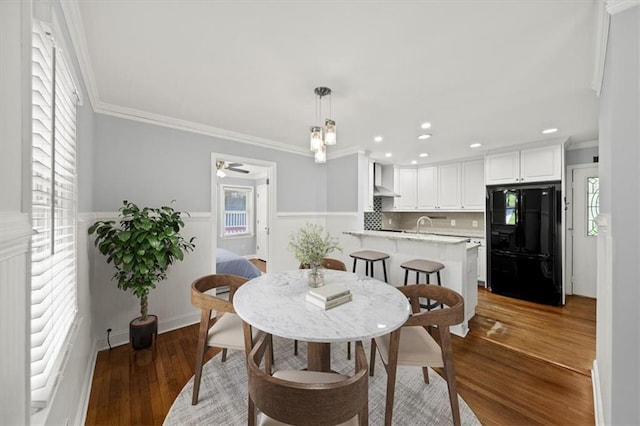2100 Shady Ln, Tucker, GA 30084 - dining area with ornamental molding, a wainscoted wall, plenty of natural light, wood finished floors, and recessed lighting
