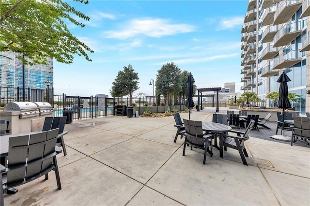 400 W Peachtree St NW Unit 3216, Atlanta, GA 30308 - view of patio / terrace featuring a pergola and an outdoor kitchen