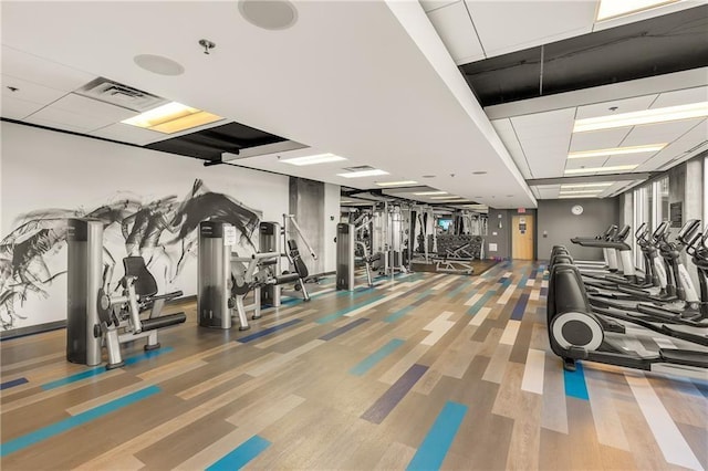 400 W Peachtree St NW Unit 3216, Atlanta, GA 30308 - workout area featuring a drop ceiling and wood finished floors