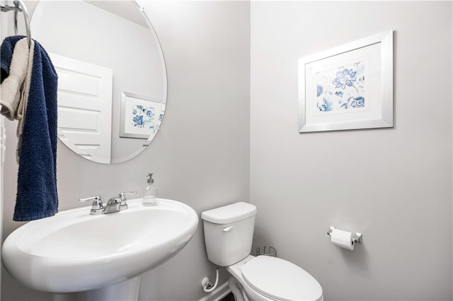 bathroom with sink and toilet