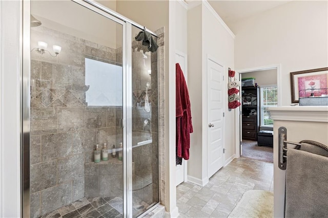 bathroom featuring a shower with door