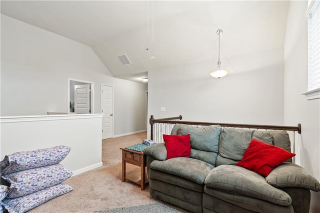 carpeted living room with lofted ceiling