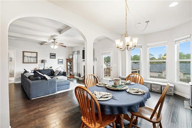 dining area featuring dark hardwood / wood-style flooring, ceiling fan with notable chandelier, and beam ceiling