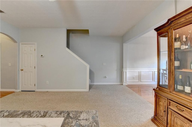 interior space featuring light carpet