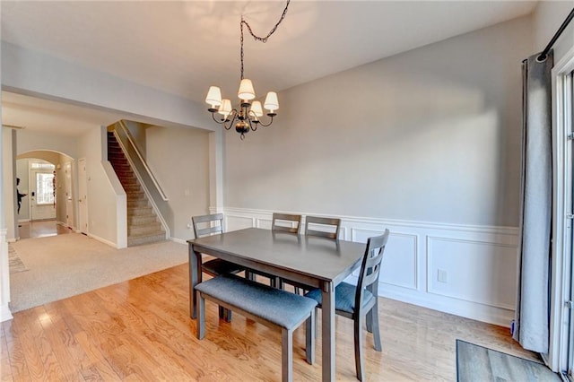 dining space featuring a chandelier and light hardwood / wood-style floors