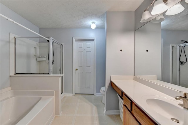 full bathroom featuring a textured ceiling, separate shower and tub, vanity, and toilet