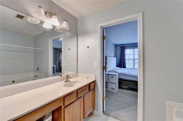 bathroom featuring a tub and vanity