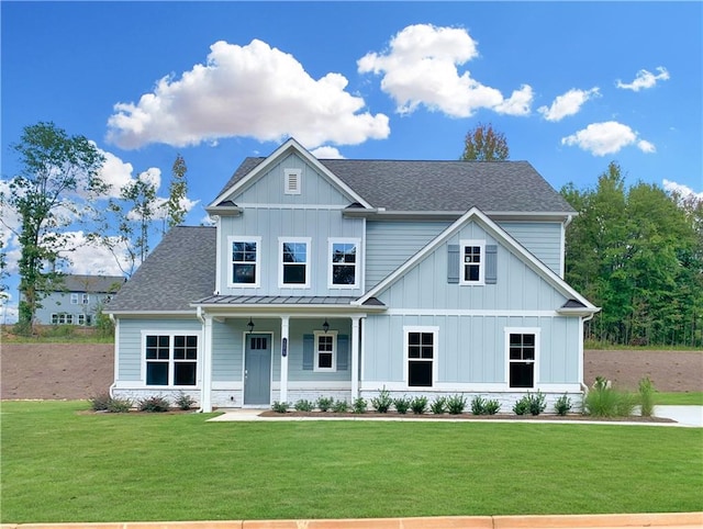 view of front of home featuring a front yard and a porch