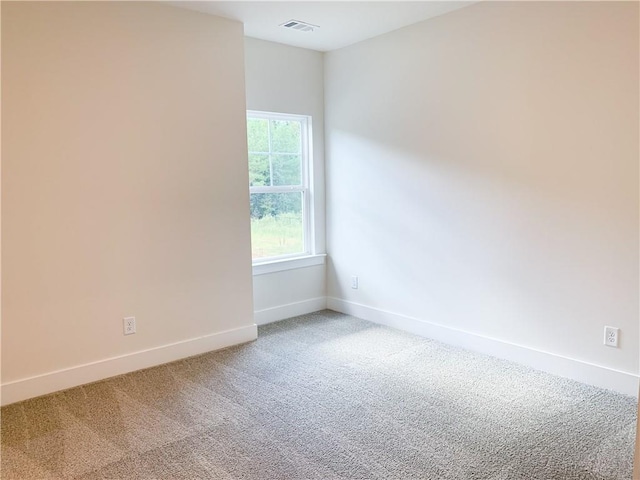 unfurnished room featuring carpet