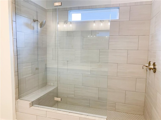 bathroom with tiled shower