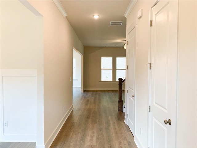 hall with light hardwood / wood-style floors