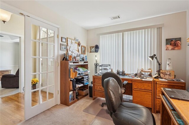 home office with light carpet