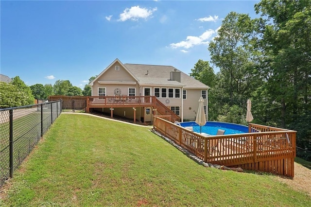 rear view of house featuring a deck and stairs