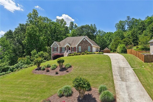 view of front of property featuring driveway and an attached garage