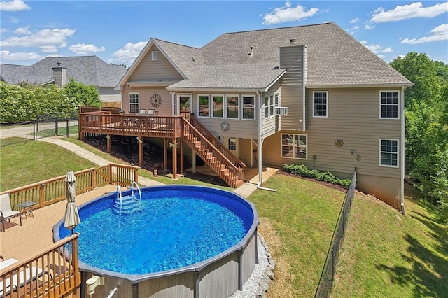 view of pool featuring a wooden deck and stairs
