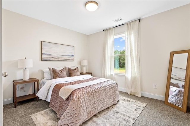 bedroom with carpet flooring and baseboards