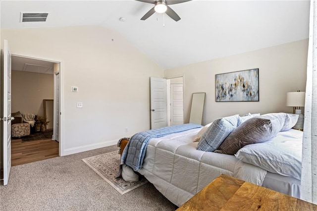 bedroom featuring attic access, vaulted ceiling, carpet, ceiling fan, and baseboards