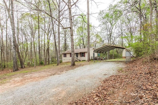 57 George Byrom Rd, Newnan, GA 30263 - view of front facade with a detached carport and driveway