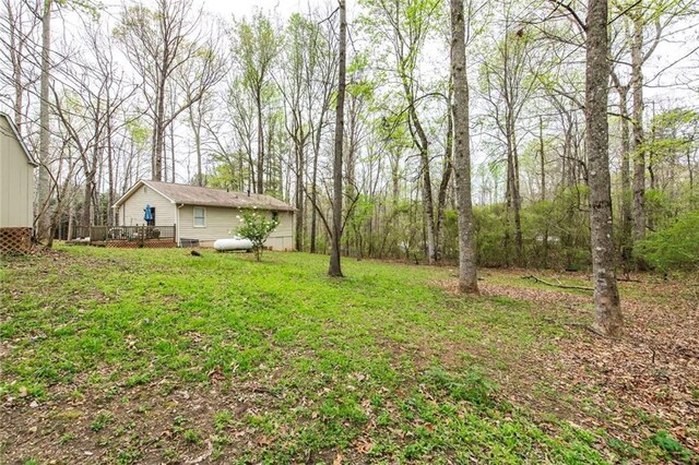 57 George Byrom Rd, Newnan, GA 30263 - view of yard with a deck