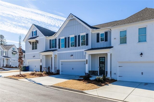 view of front of house featuring a garage and central air condition unit