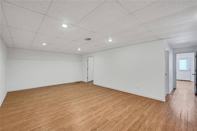 bathroom with toilet, a drop ceiling, and walk in shower