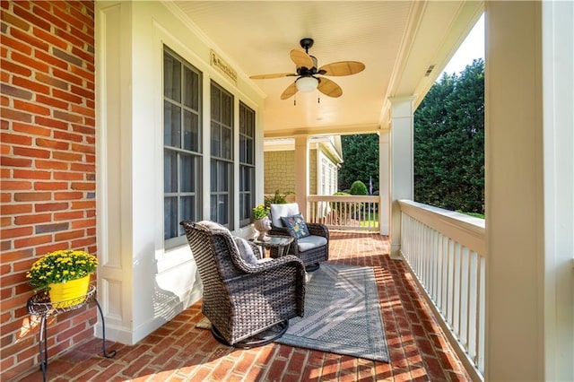 wooden terrace featuring ceiling fan