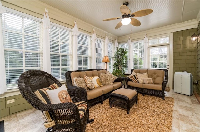 sunroom with ceiling fan