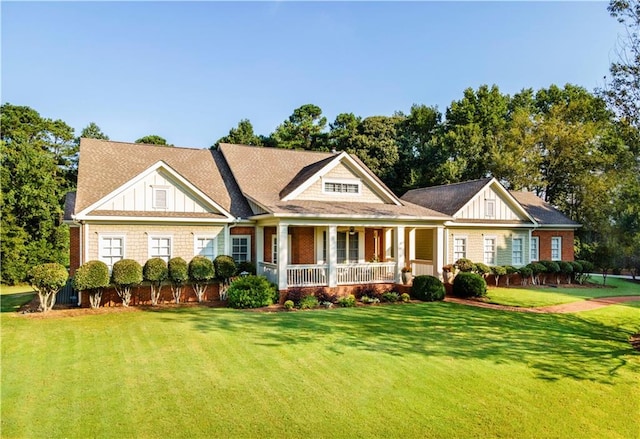 view of front of house featuring a porch and a front lawn