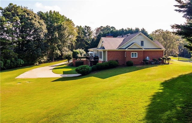 view of home's exterior with a yard