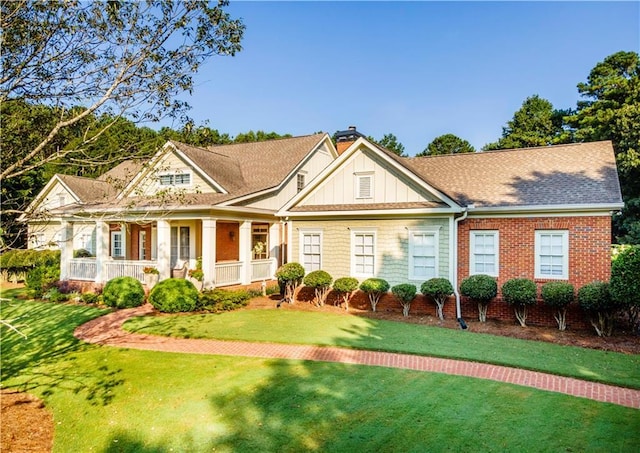 view of front facade with a porch and a front yard