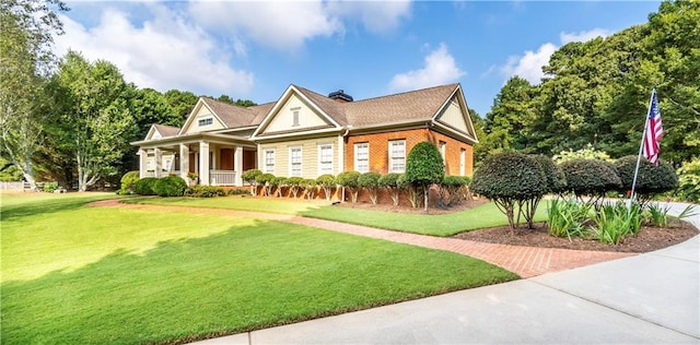 view of front of property featuring a porch and a front lawn