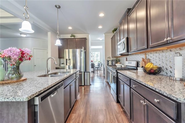2021 Adam Acres Dr, Lawrenceville, GA 30043 - kitchen with a sink, appliances with stainless steel finishes, crown molding, dark brown cabinets, and backsplash